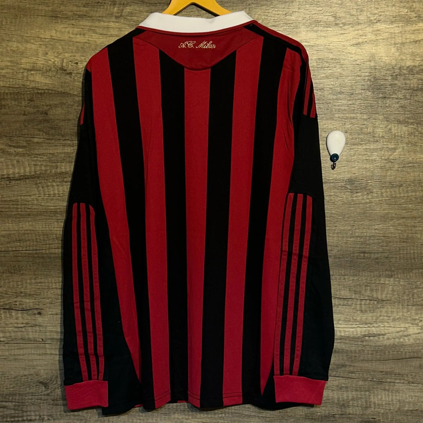 Black and red striped shirt on a wooden surface