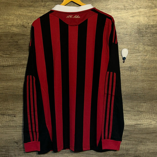 Black and red striped shirt on a wooden surface