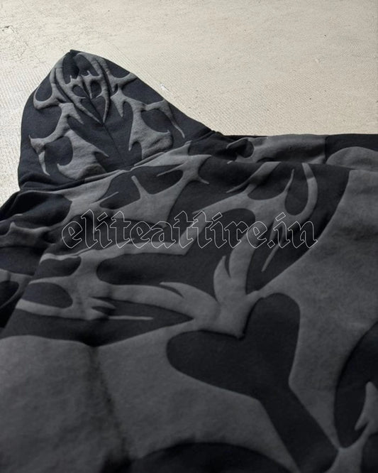 Black camouflage-patterned hoodie on a light gray background