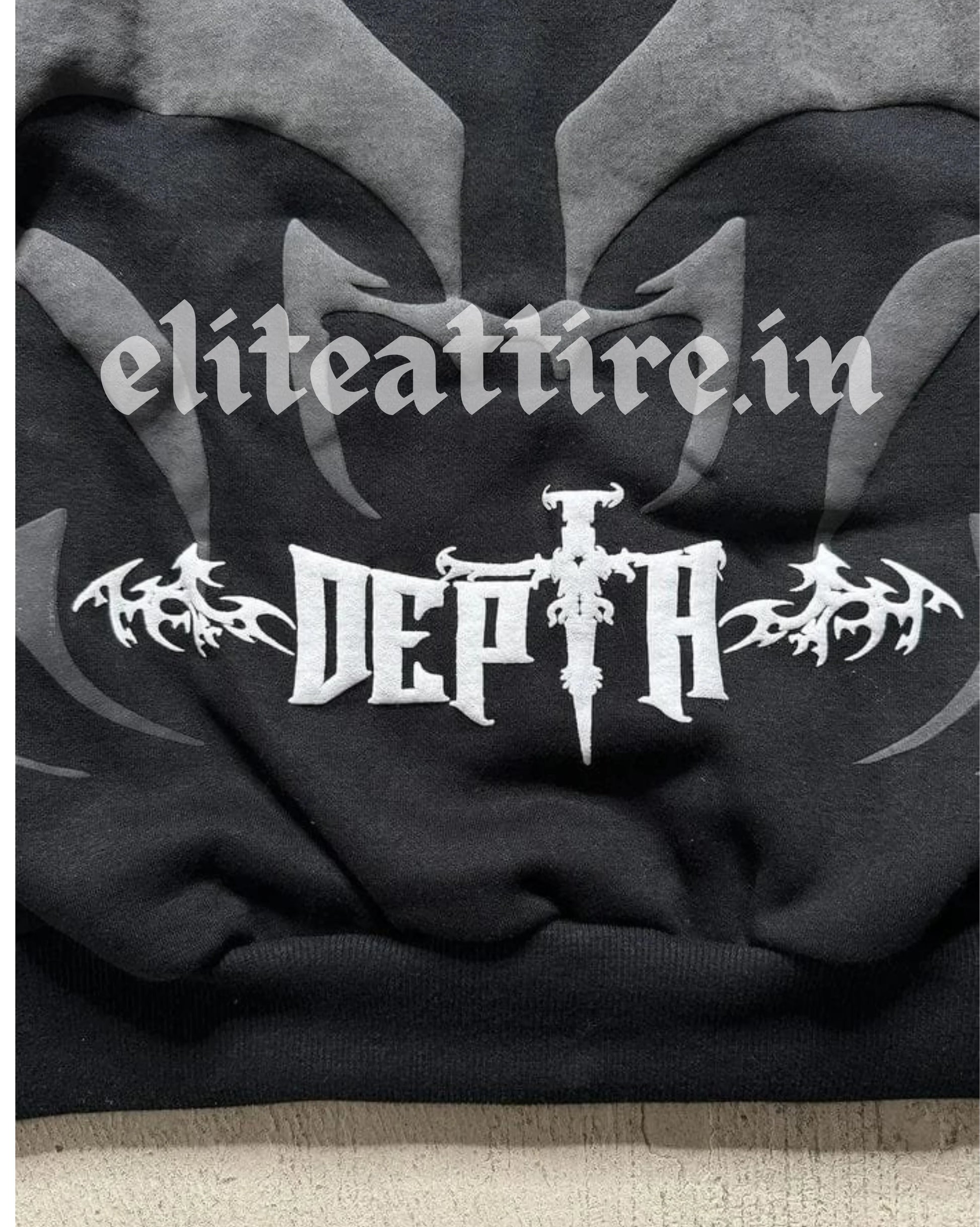 Black hoodie with white text and design on a textured surface