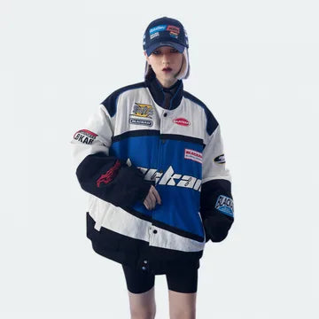 Person wearing a branded jacket and cap on a white background