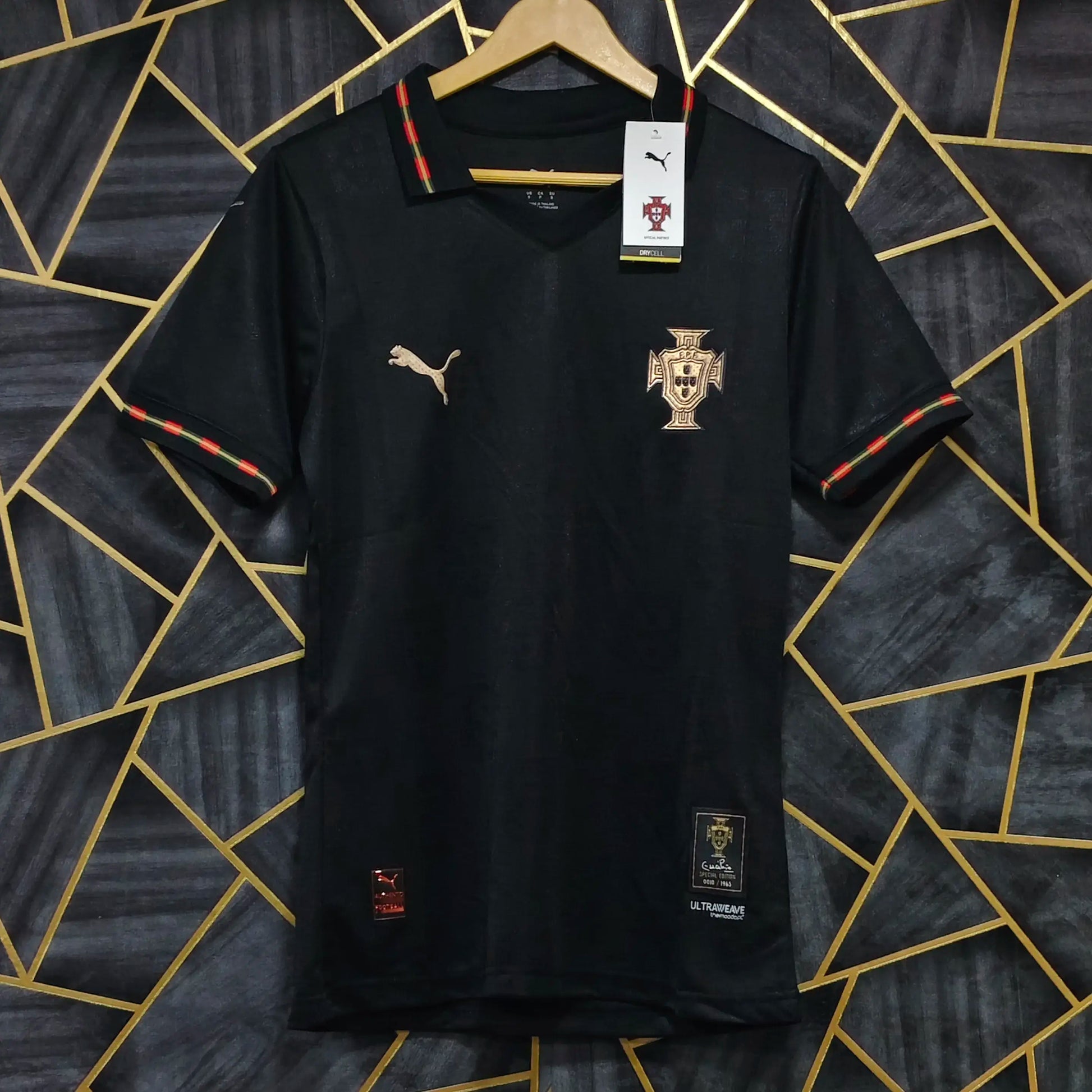 Black sports jersey with visible branding on a geometric patterned background